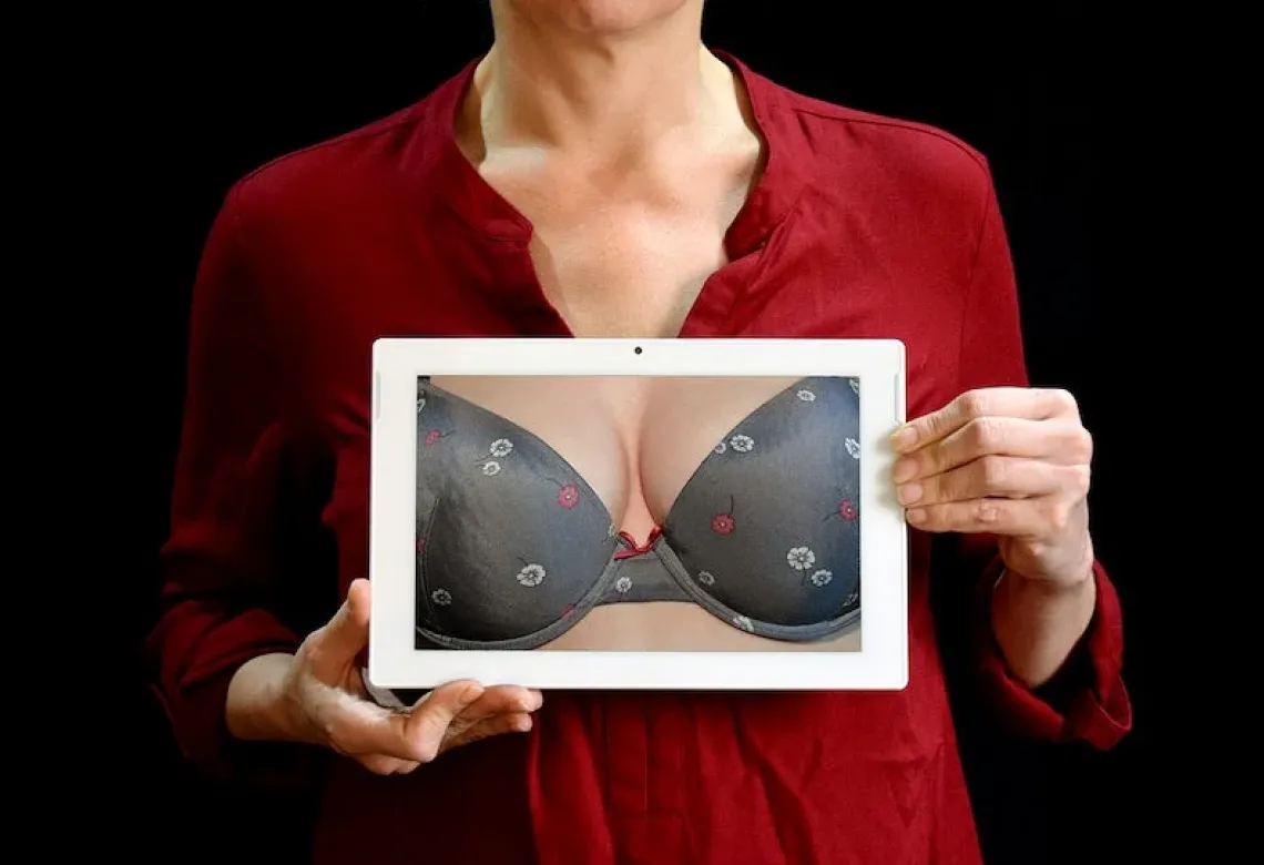 Woman showing her bra.